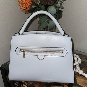 Perfect condition, never used gray purse. Strap included.